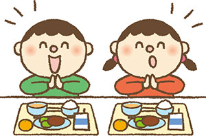 給食を食べる子供の画像